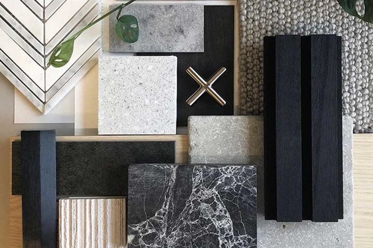 Interior by Taylor McKay, Senior Interior Designer at CoreVal Homes — a curated material and finish palette of marble, natural stone, white oak, and brushed brass